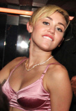 Miley Cyrus leaves little to the imagination at "Bangerz" Album Release Party