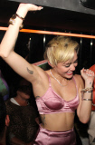 Miley Cyrus leaves little to the imagination at "Bangerz" Album Release Party