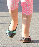 Marion and Tabitha Broderick wearing mismatched shoes