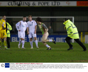 Dorchester Town player-manager Ashley Vickers sent off for tackling pitch invader in Borat mankini during football match at Havant and Waterlooville, Hampshire, Britain - 07 Mar 2011