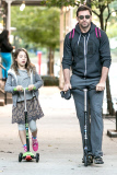 Hugh Jackman takes his daughter Ava to school on their scooters