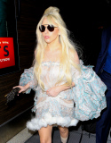 Lady Gaga at LAX holding a weird claw