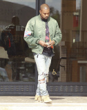 Kanye West wears his Confederate flag jacket to Barney's