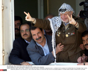RAMALLAH: Yasser Arafat greets supporters from a window of his compound