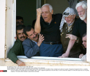 RAMALLAH: Yasser Arafat greets supporters from a window of his compound