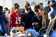 Sisters Kylie Jenner and Kourtney Kardashian are all smiles over their Yard Sale