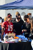 Sisters Kylie Jenner and Kourtney Kardashian are all smiles over their Yard Sale