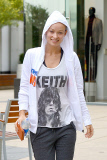 Olivia Wilde covers her Baby Bump with a Keith Richards Shirt