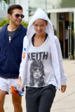 Olivia Wilde covers her Baby Bump with a Keith Richards Shirt