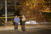 Coroners examine Paul Walker at the site of his Tragic Death