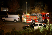 Coroners examine Paul Walker at the site of his Tragic Death