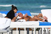 Roberto Cavalli relaxes at the beach with his new girlfriend