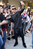 Justin Bieber takes pictures with his Fans