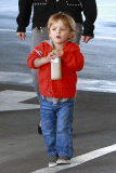 Selma Blair carries a fussy Arthur at the Farmers Market