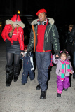 Mariah Carey and Nick Cannon keep a tight hold of the twins as they take a snowy stroll