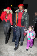Mariah Carey and Nick Cannon keep a tight hold of the twins as they take a snowy stroll