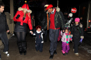 Mariah Carey and Nick Cannon keep a tight hold of the twins as they take a snowy stroll