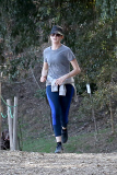 Anne Hathaway runs in the same paparazzo she left a doggie treat for on Thursday