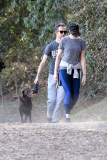 Anne Hathaway runs in the same paparazzo she left a doggie treat for on Thursday