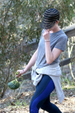 Anne Hathaway runs in the same paparazzo she left a doggie treat for on Thursday