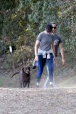 Anne Hathaway runs in the same paparazzo she left a doggie treat for on Thursday