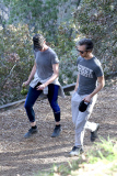 Anne Hathaway runs in the same paparazzo she left a doggie treat for on Thursday