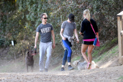 Anne Hathaway runs in the same paparazzo she left a doggie treat for on Thursday