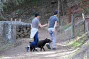 Anne Hathaway runs in the same paparazzo she left a doggie treat for on Thursday