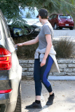 Anne Hathaway runs in the same paparazzo she left a doggie treat for on Thursday