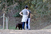Anne Hathaway runs in the same paparazzo she left a doggie treat for on Thursday