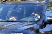 Anne Hathaway runs in the same paparazzo she left a doggie treat for on Thursday
