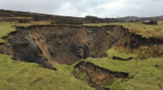 A field has disappeared into a giant sink hole at Foolow in The Derbyshire Peak District.  Locals claim the huge hole, measuring more than 160 ft across and 130 ft deep, which began collapsing yesterday and is still growing, was caused when part