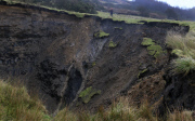 A field has disappeared into a giant sink hole at Foolow in The Derbyshire Peak District.  Locals claim the huge hole, measuring more than 160 ft across and 130 ft deep, which began collapsing yesterday and is still growing, was caused when part