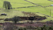 A field has disappeared into a giant sink hole at Foolow in The Derbyshire Peak District.  Locals claim the huge hole, measuring more than 160 ft across and 130 ft deep, which began collapsing yesterday and is still growing, was caused when part