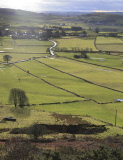A field has disappeared into a giant sink hole at Foolow in The Derbyshire Peak District.  Locals claim the huge hole, measuring more than 160 ft across and 130 ft deep, which began collapsing yesterday and is still growing, was caused when part