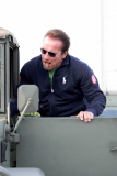 Arnold Schwarzenegger puffs away on his cigar after lunch with the guys