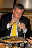 Bill de Blasio enjoys a pizza with friends