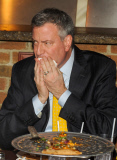 Bill de Blasio enjoys a pizza with friends