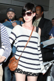 Anne Hathaway and Adam Shulman swarmed at LAX as they return from Hawaii
