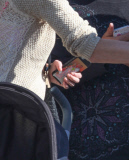 *EXCLUSIVE* Tori Spelling flashes family portrait on phone amdist divorce rumors