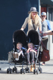 *EXCLUSIVE* Tori Spelling flashes family portrait on phone amdist divorce rumors