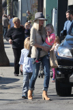 *EXCLUSIVE* Tori Spelling flashes family portrait on phone amdist divorce rumors