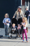 *EXCLUSIVE* Tori Spelling flashes family portrait on phone amdist divorce rumors