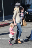 *EXCLUSIVE* Tori Spelling flashes family portrait on phone amdist divorce rumors