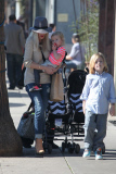 *EXCLUSIVE* Tori Spelling flashes family portrait on phone amdist divorce rumors