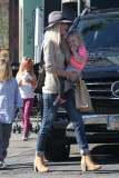 *EXCLUSIVE* Tori Spelling flashes family portrait on phone amdist divorce rumors
