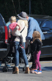 *EXCLUSIVE* Tori Spelling flashes family portrait on phone amdist divorce rumors