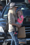 *EXCLUSIVE* Tori Spelling flashes family portrait on phone amdist divorce rumors