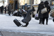 Slipping pedestrians on NYC icy sidewalk
