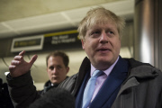 London Mayor Boris Johnson speaks to the media at London Bridge station during a strike